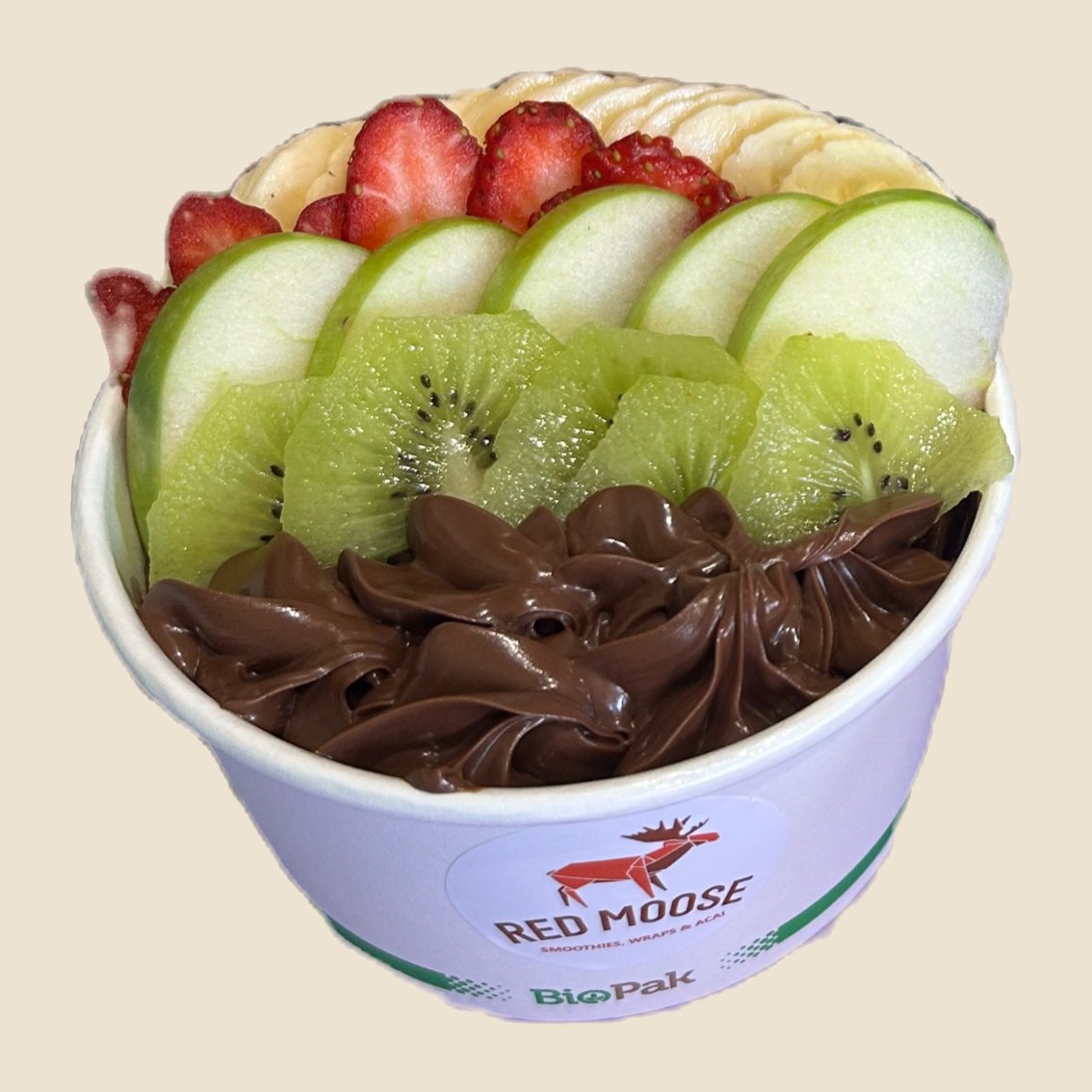 Acai bowl topped with apple, kiwi fruit, strawberries and Nutella