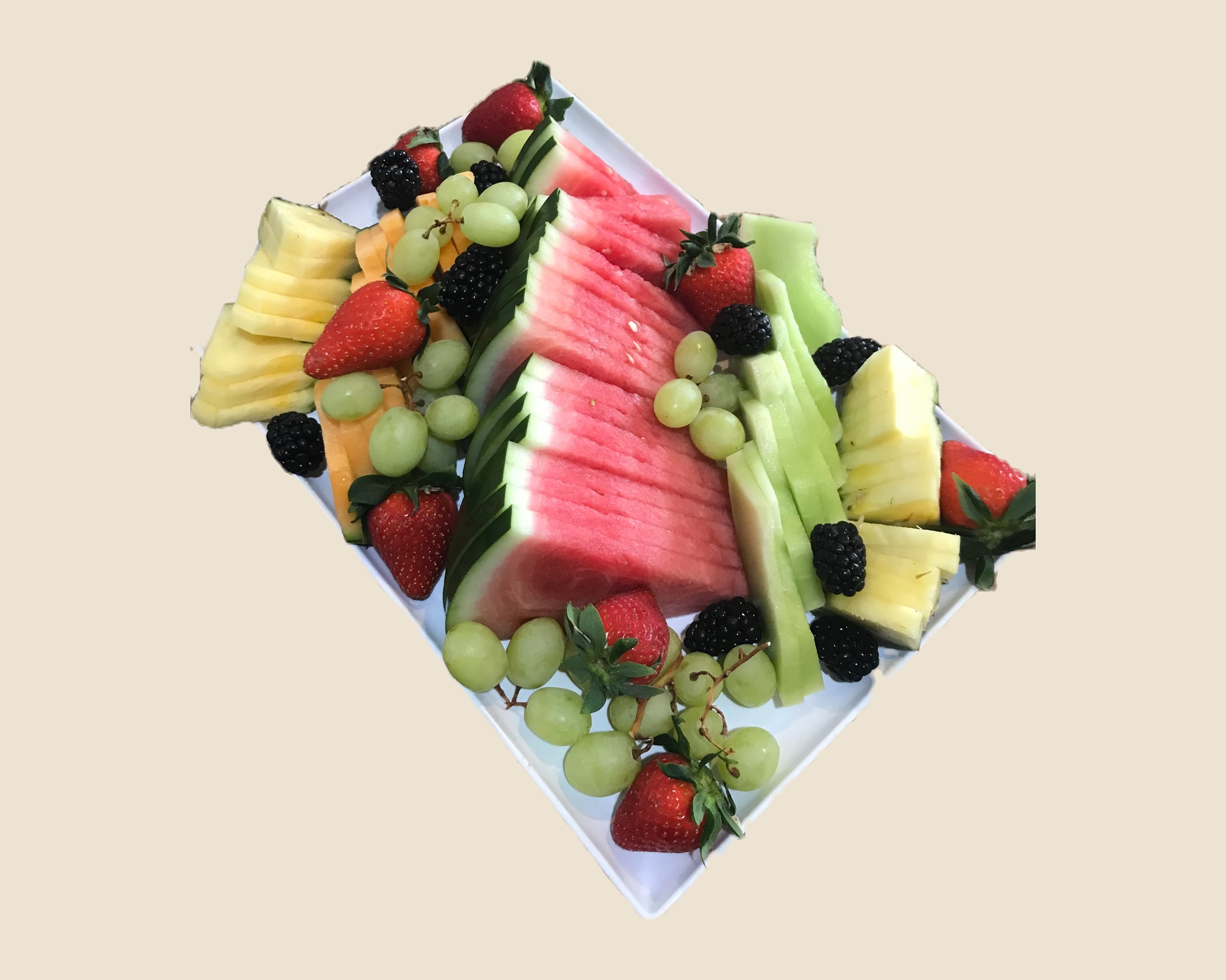 Fruit platter with watermelon, pineapple, grapes, berries and melon