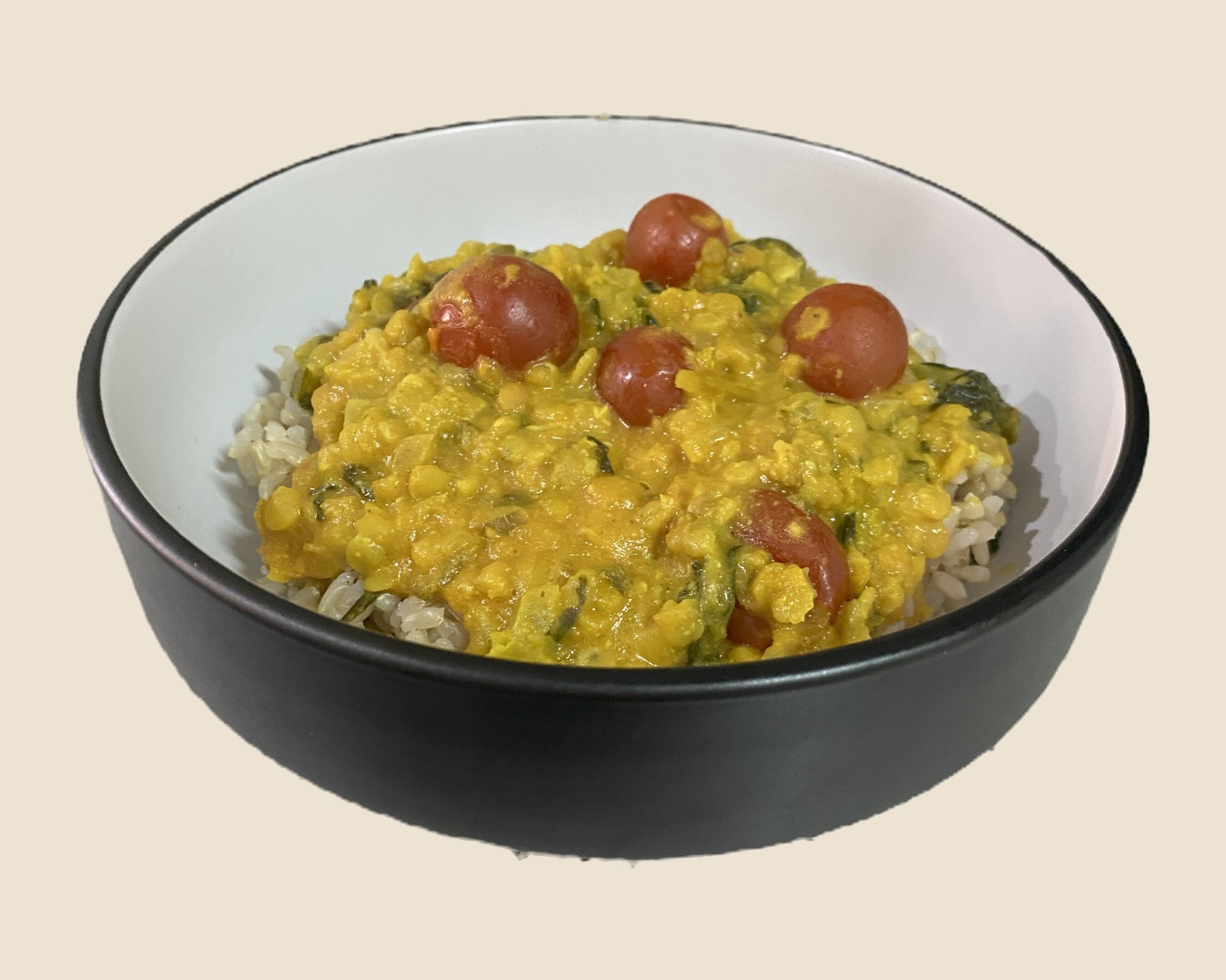 Lentil dahl with cherry tomatoes on rice